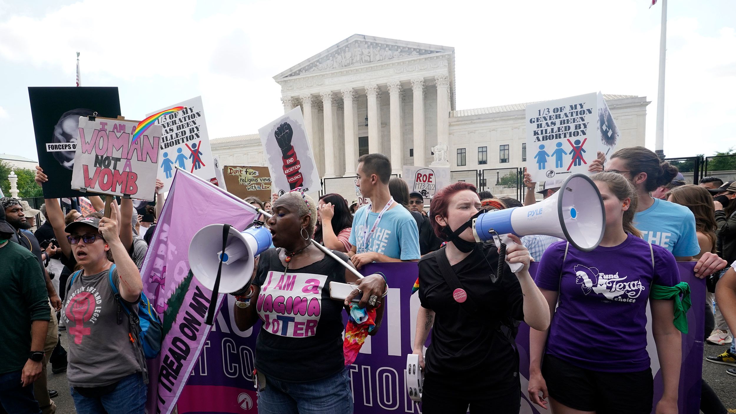 People protest about abortion, Friday, June 24, 2022, outside the Supreme Court in Washington. 