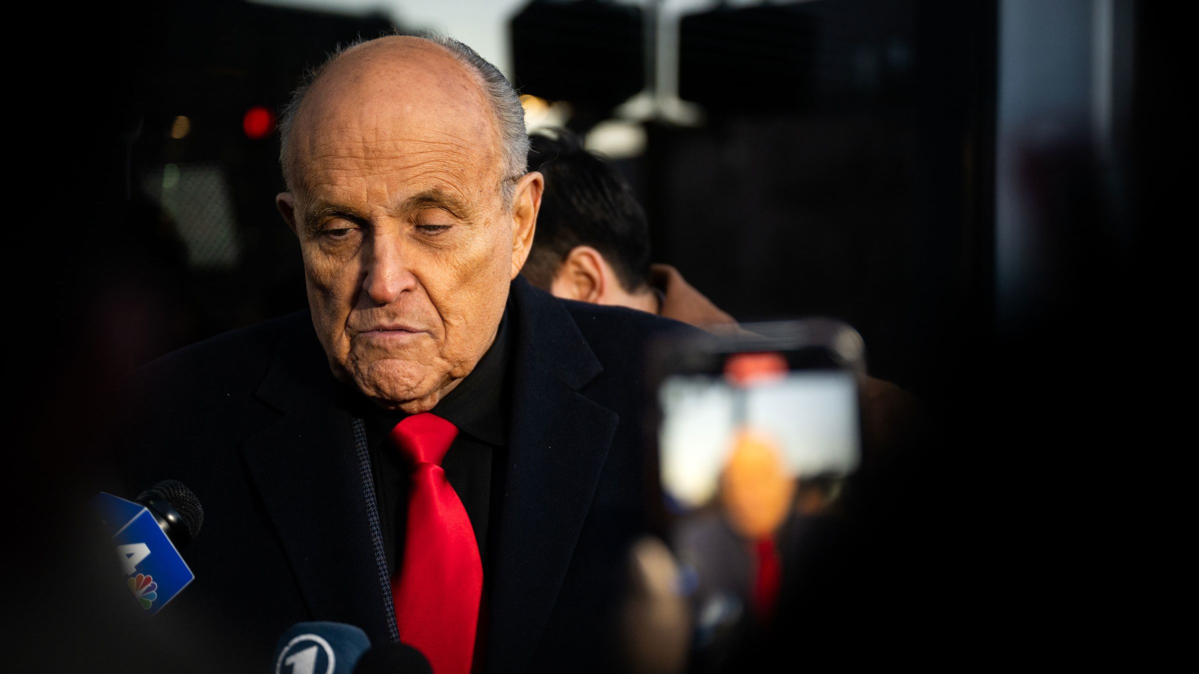 Rudy Giuliani speaks to members of the media where Republican candidate Florida Gov. Ron DeSantis was scheduled to host a campaign event on January 21, 2024 in Manchester, New Hampshire. 