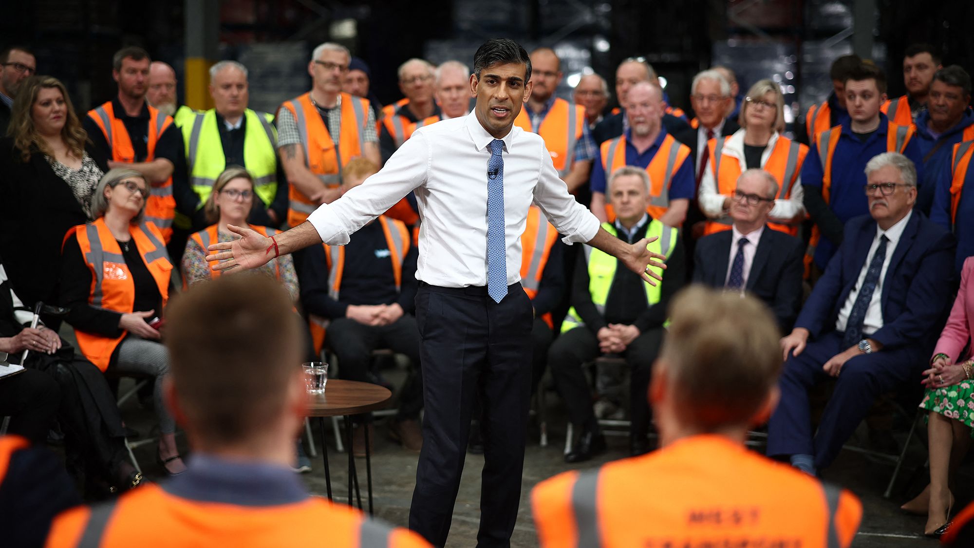 TOPSHOT - Britain's Prime Minister and Conservative Party leader Rishi Sunak holds a Q&A with staff of a West William distribution centre in Ilkeston in the East Midlands on May 23, 2024 as part of a campaign event ahead of a general election on July 4. (Photo by HENRY NICHOLLS / POOL / AFP) (Photo by HENRY NICHOLLS/POOL/AFP via Getty Images)