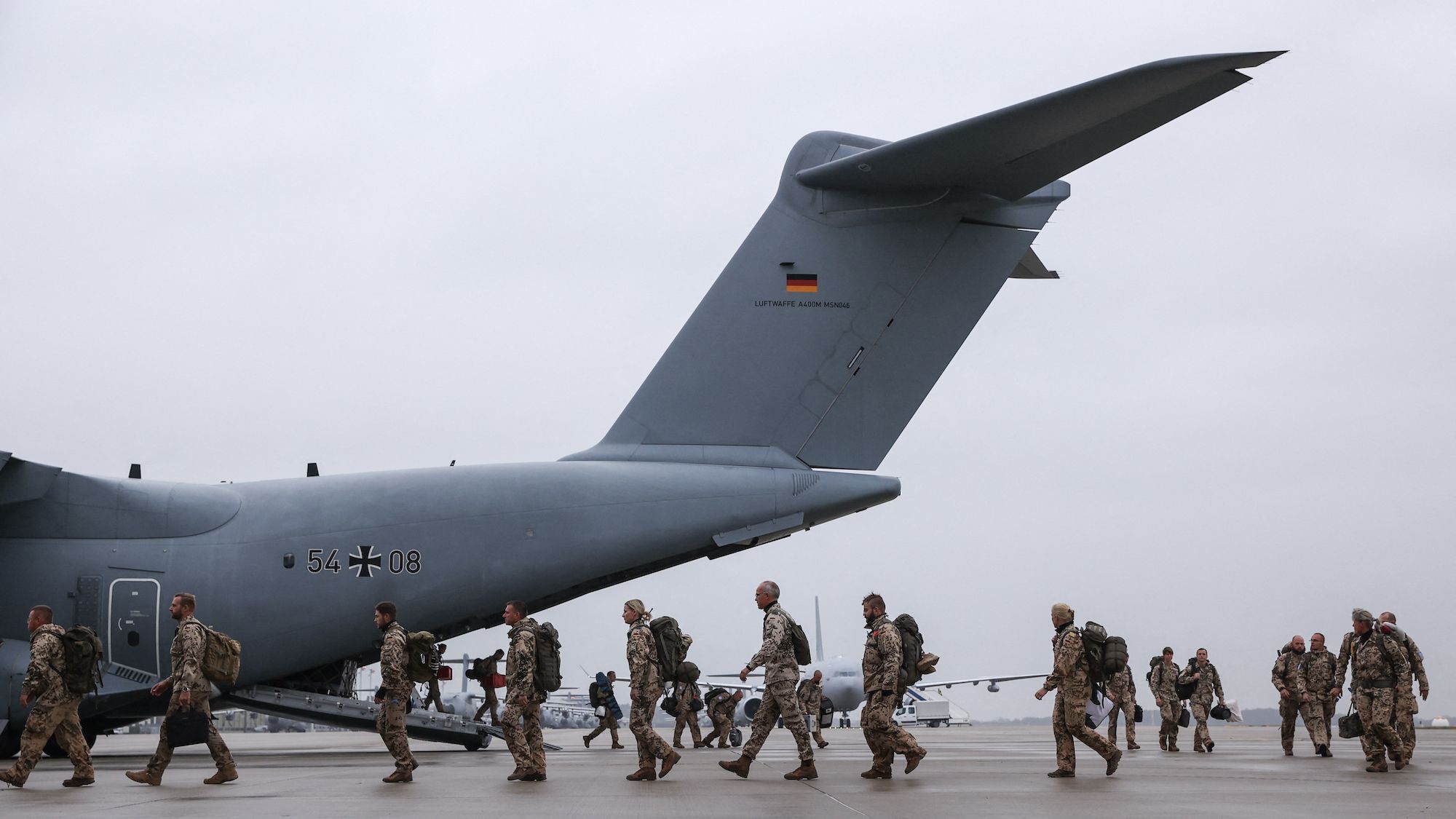 German troops returning from Mali disembark a military cargo aircraft in Wunstorf, northern Germany, on December 15, 2023.