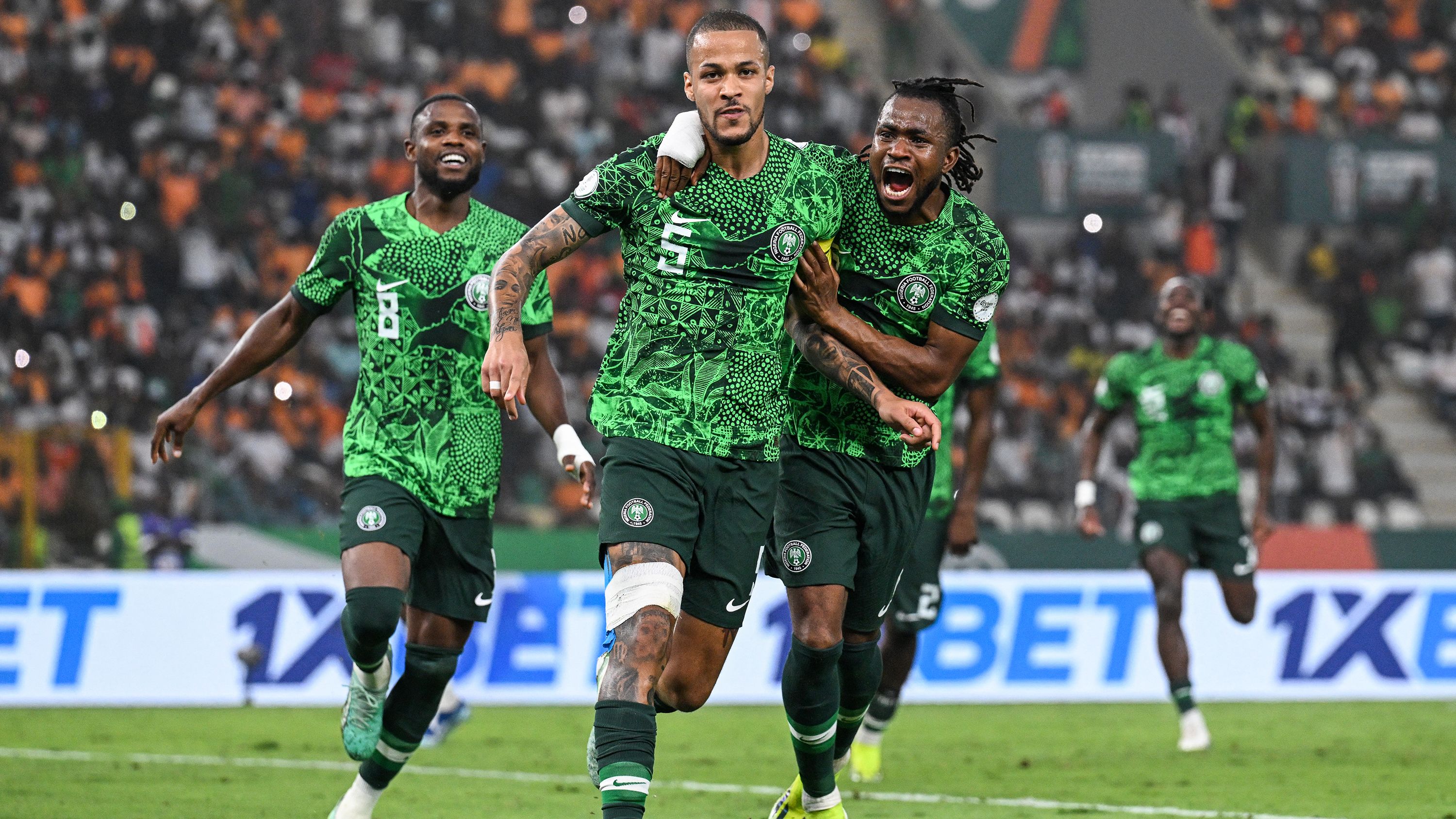 Nigeria's defender #5 William Troost-Ekong (C) celebrates with teammates after scoring his team's first goal from the penalty spot during the Africa Cup of Nations (CAN) 2024 semi-final football match between Nigeria and South Africa at the Stade de la Paix in Bouake on February 7, 2024.
