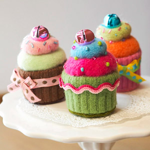Three cupcake pincushions