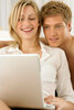 Couple using laptop