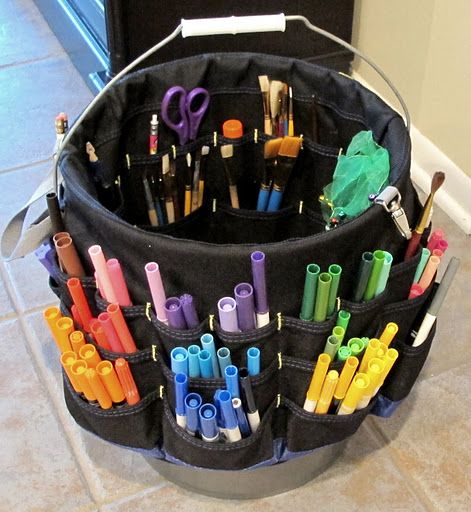 Fabric covered tool/paint organizer sold at Lowe's that is made to slip right over large industrial bucket (also sold at Lowe's).  Perfect for keeping kid's craft supplies organized!