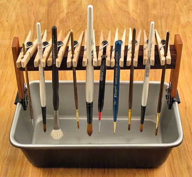 Paint brush tray - clothes pins, screws, metal clips, plastic tub, and rulers maybe