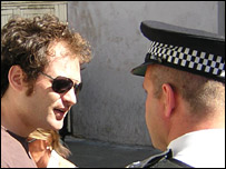 A police officer and Dan Simon