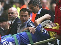 John Terry is carried away on a stretcher
