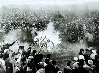 Cremation of Mahatma Gandhi at Rajghat, 31 January 1948. It was attended by Jawaharlal Nehru, Lord and Lady Mountbatten, Maulana Azad, Rajkumari Amrit Kaur, Sarojini Naidu and other national leaders. His son Devdas Gandhi lit the pyre.[119]