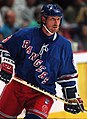 Image 14 Wayne Gretzky Photo credit: Håkan Dahlström Ice hockey player Wayne Gretzky, as a member of the New York Rangers of the National Hockey League (NHL) in 1997. Gretzky, nicknamed "The Great One", is widely considered the best hockey player of all time. Upon his retirement in 1999, he held forty regular-season records, fifteen playoff records, and six All-Star records. He is the only NHL player to total over 200 points in one season—a feat he accomplished four times. In addition, he tallied over 100 points in 15 NHL seasons, 13 of them consecutively. He is the only player to have his number (99) officially retired by the NHL for all teams. More selected portraits