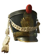 Shako dating from the Bourbon Restoration with a red company pompon.
