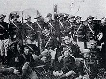 A group photograph of uniformed military officers of colonial appearance.