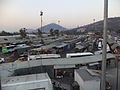 Photograph of a hub with multiple trucks, minibuses and cabs parked in it.