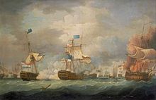 On a stormy sea beneath towering clouds, a number of sailing warships battle. In the foreground are three ships, two to the right of the frame bridged by clouds of smoke and the mainmast of the far right ship, which bears a prominent horizontally striped flag is toppling. To the left of the frame a third ship drifts as flames leap from its deck