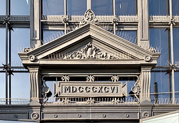 Neoclassical cartouches in and under a pediment of the Traian Hall (Calea Călărașilor no. 133), Bucharest, by Giulio Magno, 1896