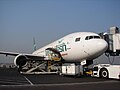 Biman's Boeing 777-200ER being loaded for its maiden commercial flight at Shahjalal International Airport, Bangladesh. (2010)