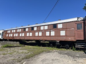 Red railway car with two levels of windows