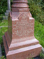 Polished red granite tombstone