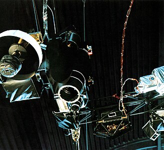 A view of some of Voyager's instruments from below. Left: the cameras, ultraviolet and infrared spectrometers (far left), plasma detector (black box lower right), particle and radiation detectors (far right). On the boom, center and right, are plasma, particle, and cosmic ray detectors.