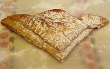 A picture of an apple-filled turnover, bought from a diner
