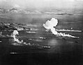 Japanese ships burning off Dublon Island, Truk Lagoon, on the first day of air strikes conducted as part of Operation Hailstone