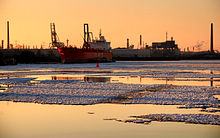 Ships in snowy Hamburg, Germany harbour