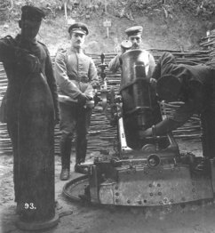 Left image: Imperial German 25 cm schwerer Minenwerfer during World War I. The left soldier is showing a 25 cm (9.8 in) mine shell as used in the artillery piece.Right image: Drawing of sectioned WWI-era shell types. The left shell is a 25 cm (9.8 in) Minenwerfer mine shell. The right shell is a 24 cm (9.4 in) conventional high-explosive shell for comparison.[1]