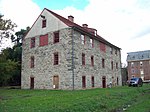 A three-story historic building in stone