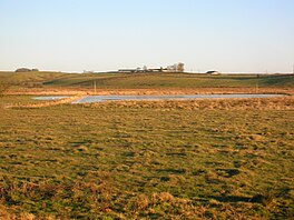 Fields flooded with a small lake or flash