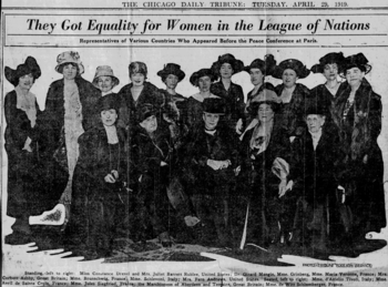 Group photograph of hatted women with five seated on the front row and eleven standing behind