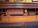 The interior of an 1895 Mason & Hamlin reed organ showing stop mechanism, swell case and Vox humana tremulant.