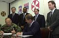 Image 30National Federation of Federal Employees officials sign a collective bargaining agreement with the U.S. 8th Army in October 2002.