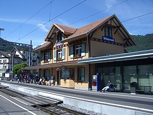 Three-story station building with gabled roof