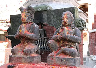 Malla king and queen doing Namaste (the ritual greeting) in front of the Chandeshwari Temple.
