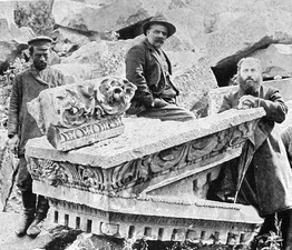 Toros Toramanian pictured sitting on part of the pediment[79]