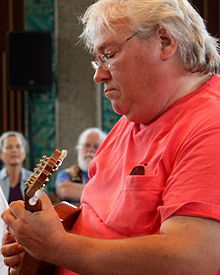 Peter Ostroushko playing mandolin in 2014