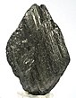 A black multi-layered lozenge-shaped rock