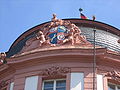 Coat of arms of the Ostein dynasty, framing the central risalit on the facade