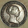 Anverso de moeda de 20 reais de Isabel II con «ceca» de Sevilla do ano 1854.