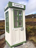 Photo of a green-and-white telephone booth