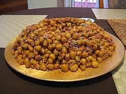 Struffoli is a Neapolitan dish made of deep fried balls of dough about the size of marbles.
