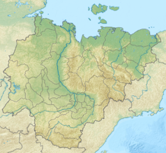 Mapa konturowa Jakucji, po prawej znajduje się czarny trójkącik z opisem „Tas-Kystabyt”