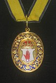 連合王国準男爵の徽章。「アルスターの赤い手」が描かれている。