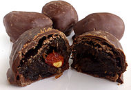 Russian prunes in chocolate with an almond in the middle