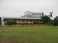 Del Pilar Academy (Blue Building) behind Imus Pilot Elementary School