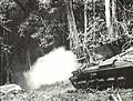 Matilda tank of A Squadron, 1st Tank Battalion, fires at a Japanese foxhole