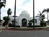 Americanization School, a low white building with a central dome above the entrance