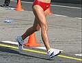 Image 27A racewalker "flying" (entirely out of contact with the ground, a rule violation) (from Racewalking)