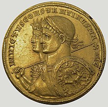 photo of gold coin issued by Constantine I with his picture and the god Sol's picture on it