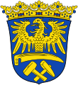 Herb Górnego Śląska (wersja z połową orła, ostrzem kosy i młotami)