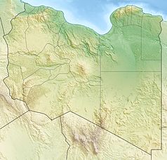 Mapa konturowa Libii, na dole nieco na prawo znajduje się czarny trójkącik z opisem „Bikku Bitti”